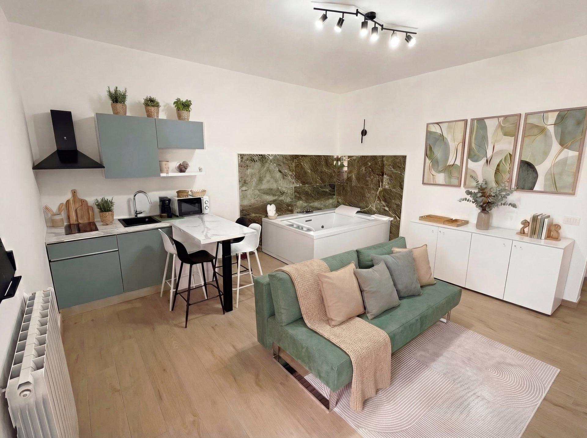 Spacious living space with kitchen island and contemporary decor in Sunset Garden Terra