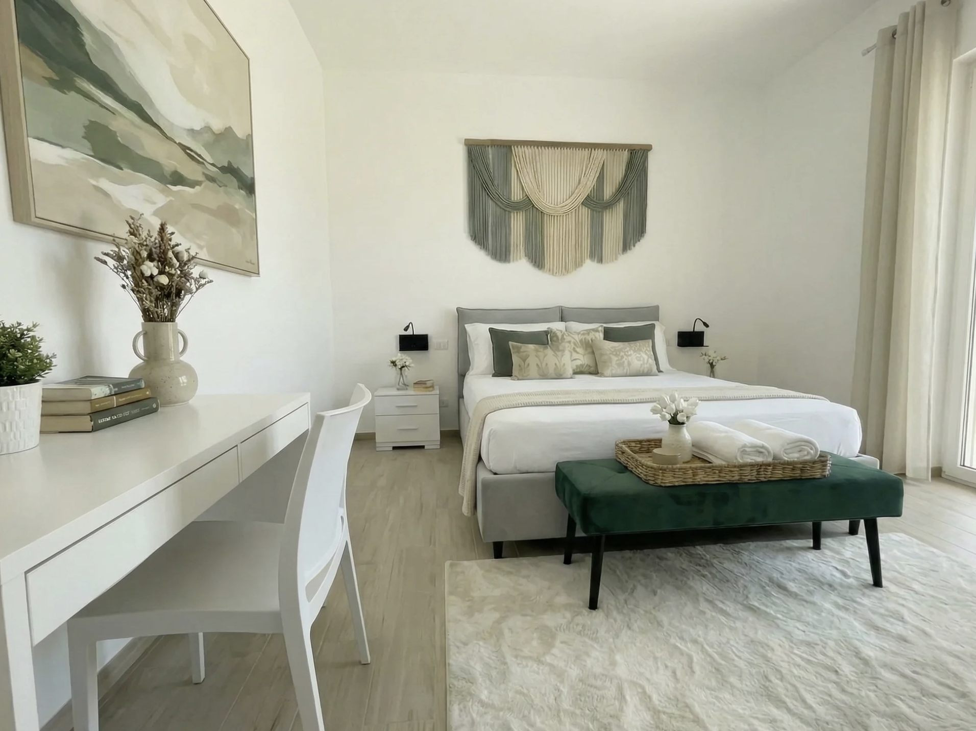 Designer bedroom in Terra apartment with macramé wall art and landscape painting